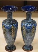 A PAIR OF ROYAL DOULTON BLUE GLAZED NARROW NECK VASES, 23cms tall
