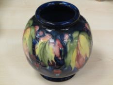 MOORCROFT 'WISTERIA' BLUE GROUND BALUSTER VASE, 16cms height