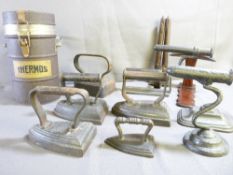 A COLLECTION OF VINTAGE GOFFERING FLAT IRONS, a military thermos flask and similar items