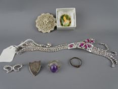 A PINK STONE AND CZ STATEMENT NECKLACE, a composite floral brooch and two others, a cabochon