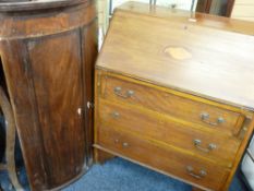 AN EDWARDIAN MAHOGANY BUREAU with shell inlay to the slope front and three drawers to the base (some