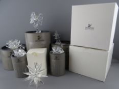 A SWAROVSKI CRYSTAL SOCIETY BALD EAGLE and five other items, all boxed, to include a leaping