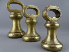 A SET OF THREE PARNALL AND SONS LIMITED BRASS BELL WEIGHTS, 7/4/2 LB fully proof stamped with