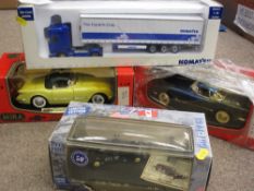 FOUR BOXED SCALE MODEL DIECAST VEHICLES, various makes