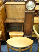 OAK CASED POLISHED GRANDMOTHER CLOCK , dome topped with silver dial, a small oval coffee table, a