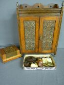 AN OAK TWO DOOR SMOKER'S CABINET, inlaid cigarette box, carved and other pipes along with other