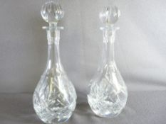 A MATCHING PAIR OF ROYAL DOULTON CUT GLASS DECANTERS with stoppers