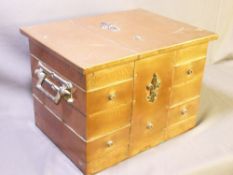 A COPPER LOG BOX with iron handles and applied motif, 35cms height, 52cms width, 57cms depth