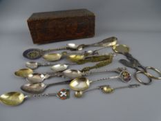 A POKERWORK LIDDED BOX containing a quantity of mainly silver collector's spoons including Welsh