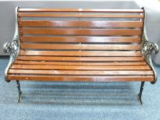 A VINTAGE CAST IRON AND SLATTED-SEAT GARDEN BENCH, 75.5cms height, 126cms width, 65cms depth