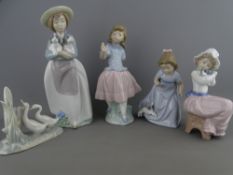 FOUR NAO PORCELAIN FIGURINES and a small group study of ducks, 25.5cms height the tallest