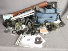 AN OLYMPUS OM10 SLR CAMERA, additional lenses, filters and associated equipment with a canvas