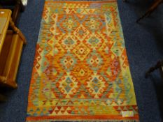 A VEGETABLE DYE WOOL CHOBI KELIM RUG, multi coloured with double border and classical central