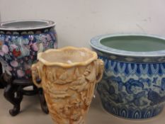 A BLUE & WHITE BUTTERFLY DECORATED FISH BOWL, 31cms diameter, 23cms height, a smaller fish bowl on a