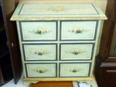 A FLORAL PAINTED CHEST OF DRAWERS with three long drawers in the continental style