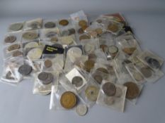 A LARGE PARCEL OF WALLETED MIXED COINAGE AND TOKENS