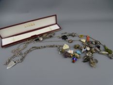 AN UNUSUAL ENAMEL GOLLY FIGURE, forty nine further charms and a silver Albert T Bar and clip with