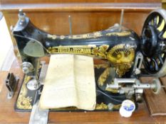 FRISTER AND ROSSMANN HAND SEWING MACHINE in a mahogany case, the machine well decorated in the