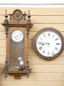 A CIRCULAR DIAL SINGLE FUSEE WALL CLOCK and a Vienna style walnut cased wall clock, 39cms diameter
