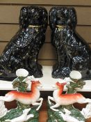 STAFFORDSHIRE FIGURES - a pair of Leaping Deer spill holders and a pair of black and gilt painted