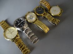 A PARCEL OF FIVE GOOD GENTLEMAN'S WRISTWATCHES, all with metal bracelets and including a good slim