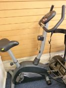 A NEAT CARL LEWIS EXERCISE BICYCLE with performance calibrations ETC