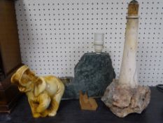A STONEWARE LIGHTHOUSE TABLE LAMP, another similar stoneware lamp and a composition elephant