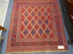 A CAZAK RUG central block diamond pattern on a red ground with multi bordered edge, 126 x 110cms