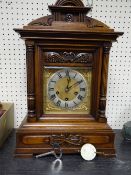 A JUNGHANS STEEPLE TOPPED MANTEL CLOCK with chime stroke movement