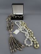 A SILVER AND IRIDESCENT BEAD NECKLACE, tasseled to the end, two others and a bracelet of six
