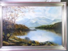 OIL ON CANVAS - lakeside scene with sun dappled mountain in background, 60 x 90cms