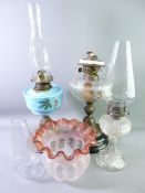 TWO VICTORIAN OIL LAMPS AND ONE OTHER including a cut glass font example with black pot base and