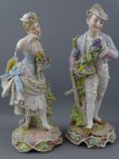 FINELY PRESERVED PAIR OF DRESDEN FIGURINES, a young lady and beau, each holding flowers and fruit