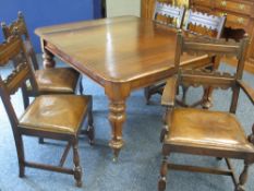 A VICTORIAN MAHOGANY WIND-OUT DINING TABLE and a set of five (4+1) oak dining chairs with rexine