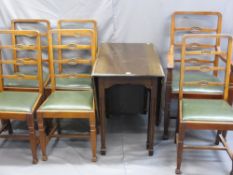 A MAHOGANY DROP LEAF TABLE on tapered supports with a fine set of six (five plus one) dining