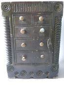 A WELSH SLATE FOLK ART DOORSTOP modelled as a tall chest of dummy drawers with brass knobs, shaped
