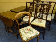 TWO NEAT OAK GATE LEGGED DINING TABLES, a set of four pierced splat back dining chairs and a