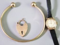 A 9CT GOLD CASED ROTARY LADY'S WRIST WATCH, cuff bangle and an individual padlock clasp, 8.8grms