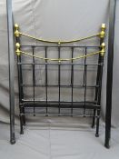 AN IRON SINGLE BED FRAME with brass finials and top rail