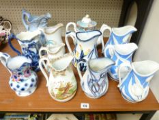 A LARGE PARCEL OF STAFFORDSHIRE RELIEF & OTHER JUGS including a D J Evans & Co, Swansea 'Birds' jug