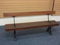 A RAILWAY STATION TYPE REVERSIBLE BENCH, 182cms long