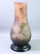 A GALLE STYLE CAMEO GLASS BULBOUS VASE on a black glass stand, 30cms height the vase
