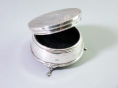 A CIRCULAR SILVER TRINKET BOX, Birmingham hallmarks with machined and chase decorated top on three
