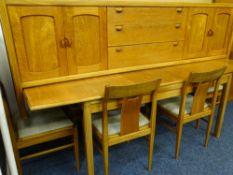 AN EXCELLENT VINTAGE NATHAN TEAK DINING ROOM SUITE of long sideboard, extending table and six