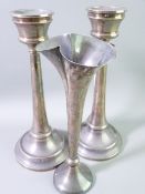 A PAIR OF SILVER CANDLESTICKS AND A TRUMPET VASE, Birmingham 1919 and Sheffield 1919 respectively,