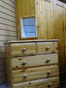 MODERN PINE BEDROOM FURNITURE - a two door wardrobe, a chest of three long and two short drawers