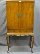 A REPRODUCTION REGENCY STYLE COCKTAIL CABINET, 152cms height, 76cms width, 34cms depth