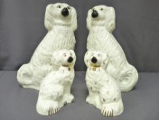 TWO PAIRS OF STAFFORDSHIRE DOGS