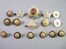 A GROUP OF MILITARY BADGES AND BUTTONS