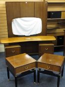 A VINTAGE G PLAN BEDROOM SUITE comprising bi-fold door wardrobe, a pair of bedside cabinets and